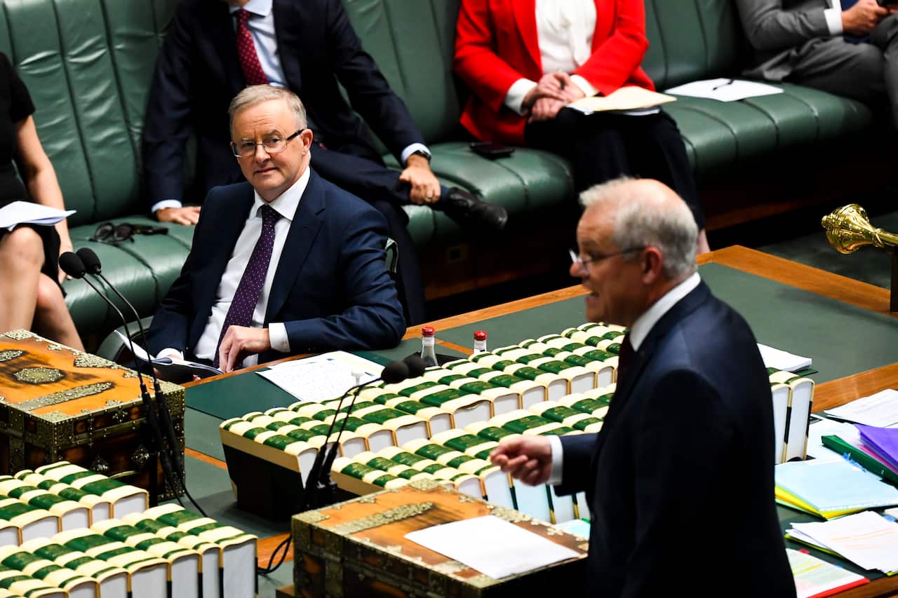 Australian Opposition Leader Anthony Albanese (left) listens to Prime Minister Scott Morrison at Parliament House in Canberra, Wednesday, May 26, 2021. 