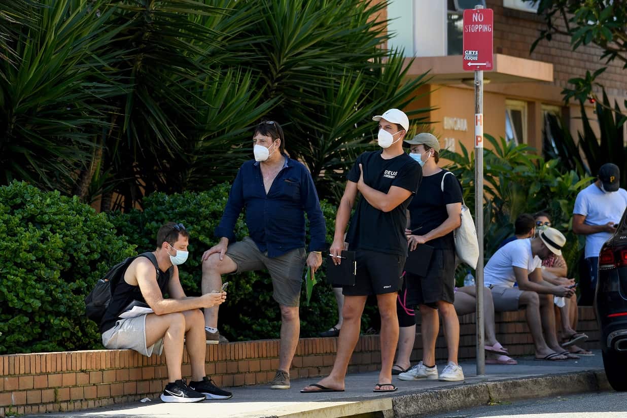 Members of the public queue for a COVID-19 PCR test at a doctors surgery in Sydney.