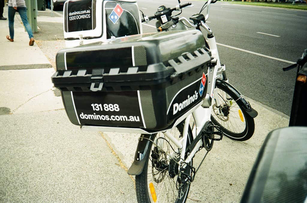 Pizza delivery bike. Food deliverers use different modes of transport.  