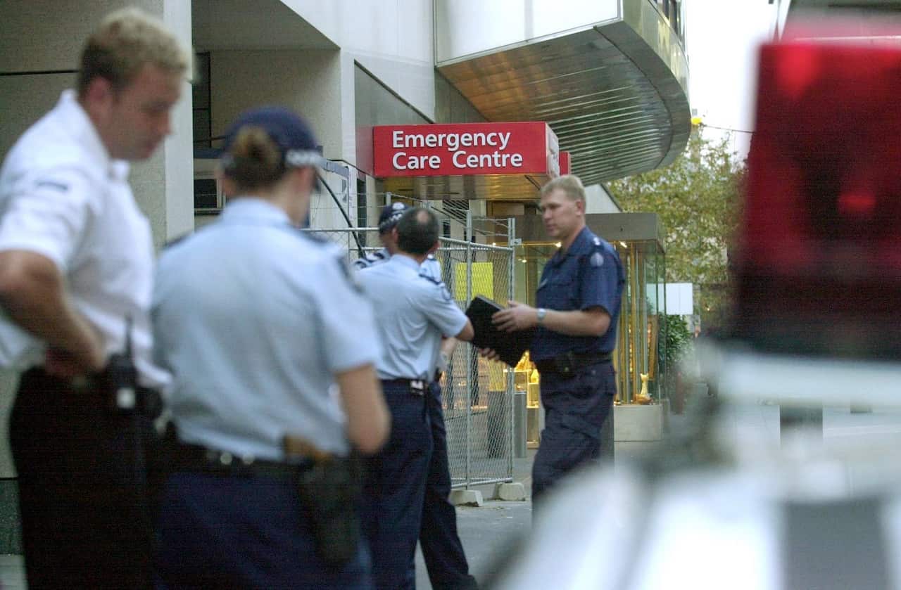 Melbourne, May 7, 2002. Police begin investigations at St.Vincents Hospital where a man was shot dead this afternoon. The man, a prisoner under-going medical treatment was shot whilst trying to escape. (AAP Image/Julian Smith) NO ARCHIVING