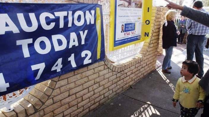 Crowds gather outside an residential auction in Sydney’s inner west