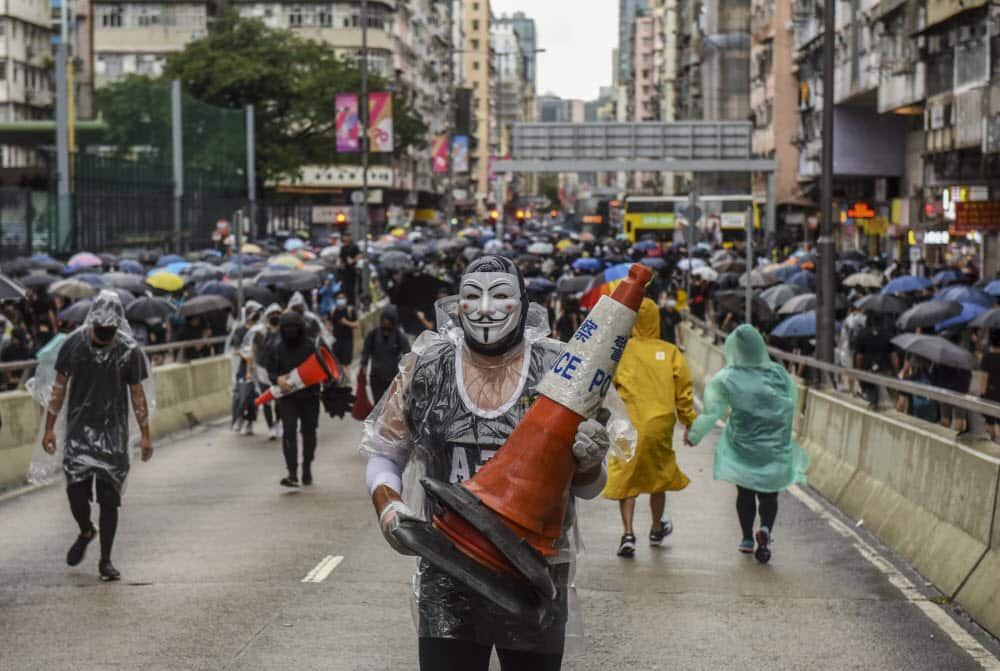 Tens of thousands turn out to defy Hong Kong face mask ban