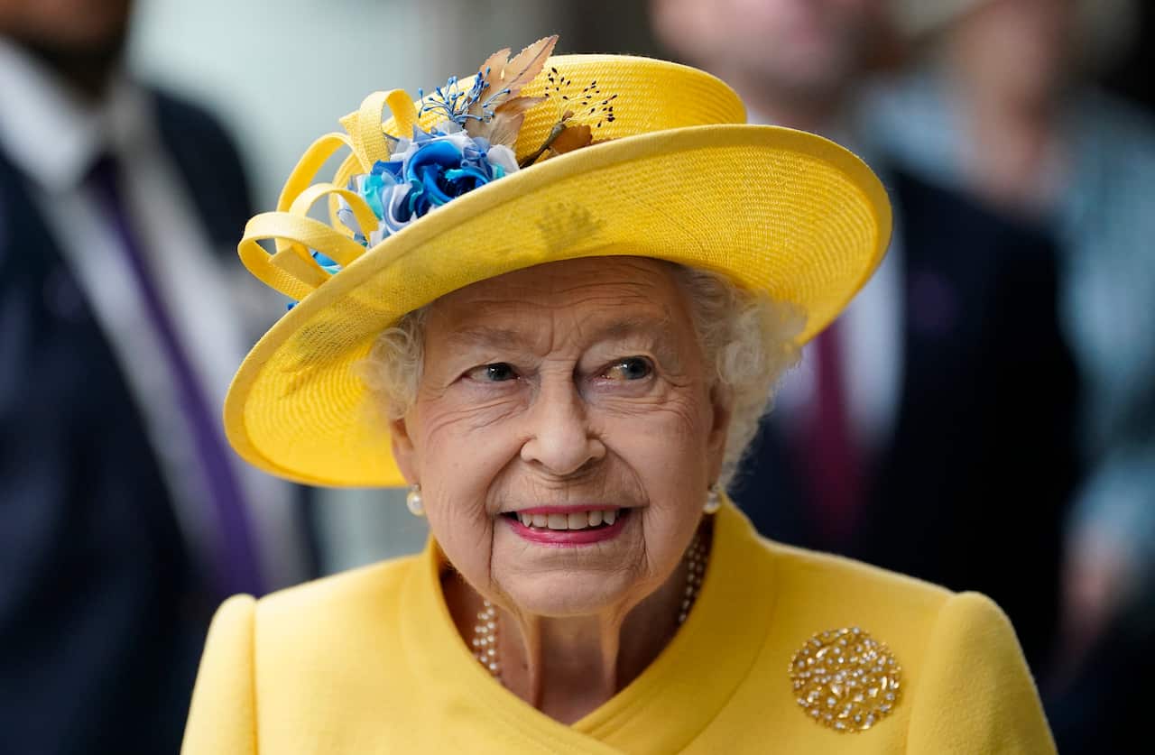 Britain's Queen Elizabeth II meets staff of the Crossrail project, and Elizabeth Line staff, at Paddington station in London, to mark the completion of London's Crossrail project, Tuesday, May 17, 2022. (Andrew Matthews/Pool via AP)