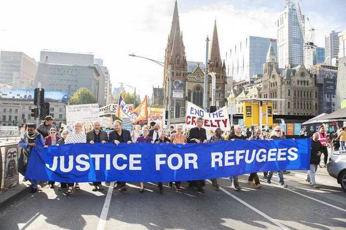 Refugee advocates at a Palm Sunday Rally outside the State Library in Melbourne