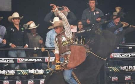 Brazilian rodeo cowboy on bull