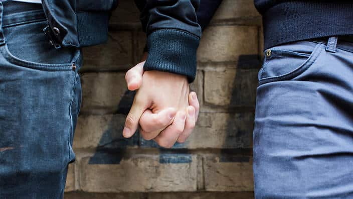 Close Up of Gay Couple Holding Hands