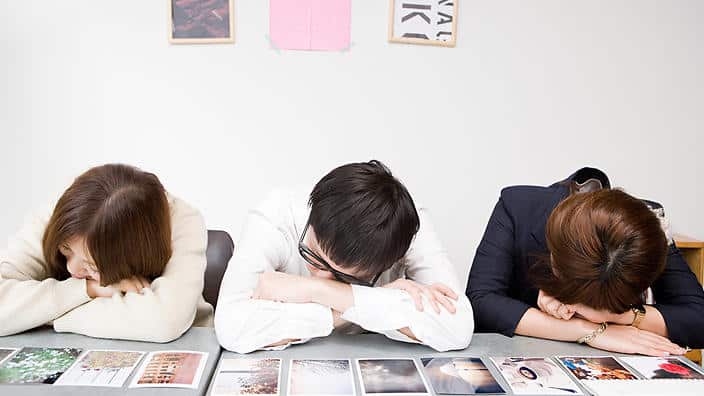 People sleeping by photographs