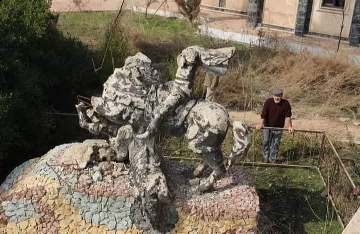 Standing next to an Assyrian monument destroyed by ISIS in Mosul.