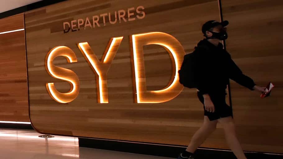 A passenger walks at the departure area of Sydney Airport, in Sydney, Australia, March 18, 2020.  
