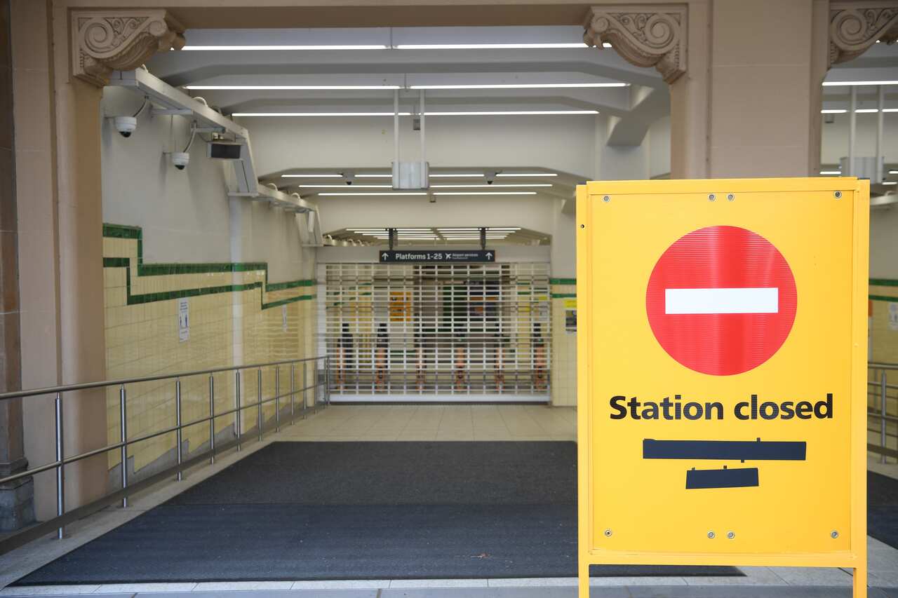 Commuters arrive at the closed Central Station during the shutdown of Sydney's train network in Sydney, Monday, February 21, 2022. All trains across Sydney and NSW have been cancelled. (AAP Image/Dean Lewins) NO ARCHIVING