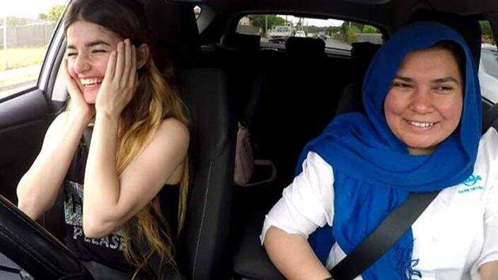 Syrian refugee Babel Youkhana with driving instructor Noor Sheerazi 
