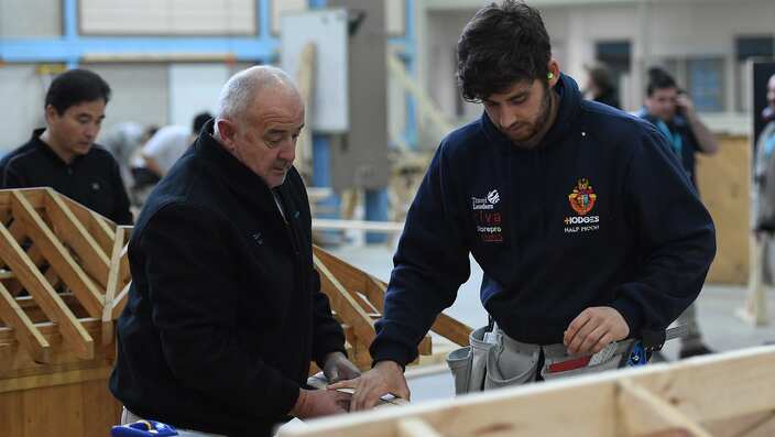 A master and apprentice carpenter are seen at Holmesglen TAFE Chadstone campus in Melbourne, Monday, May 15, 2017. (AAP Image/Julian Smith) NO ARCHIVING