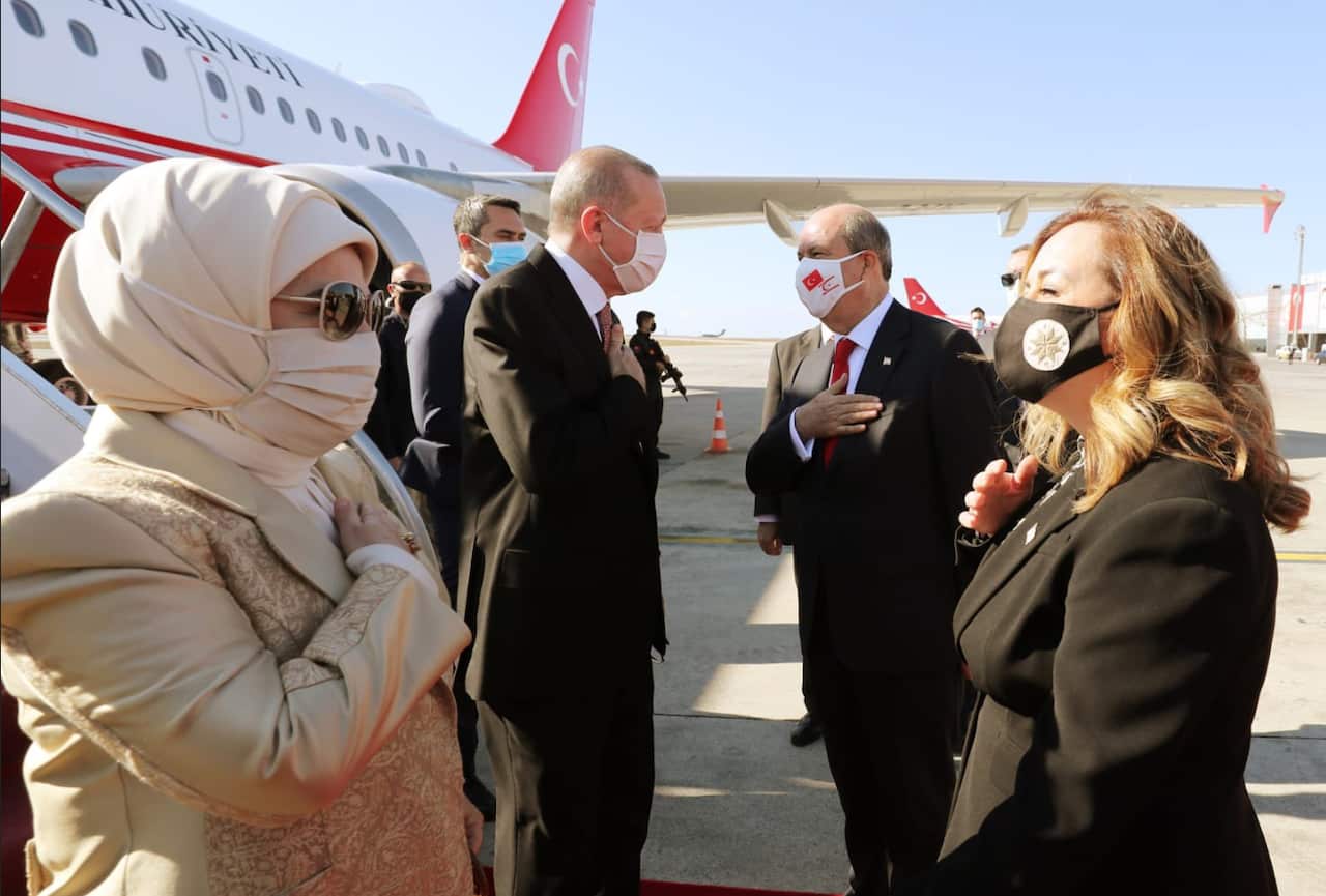 Recep Tayyip Erdogan and Ersin Tatar with their wifes meeting upon Erdogan's arrival at Nicosia's airport