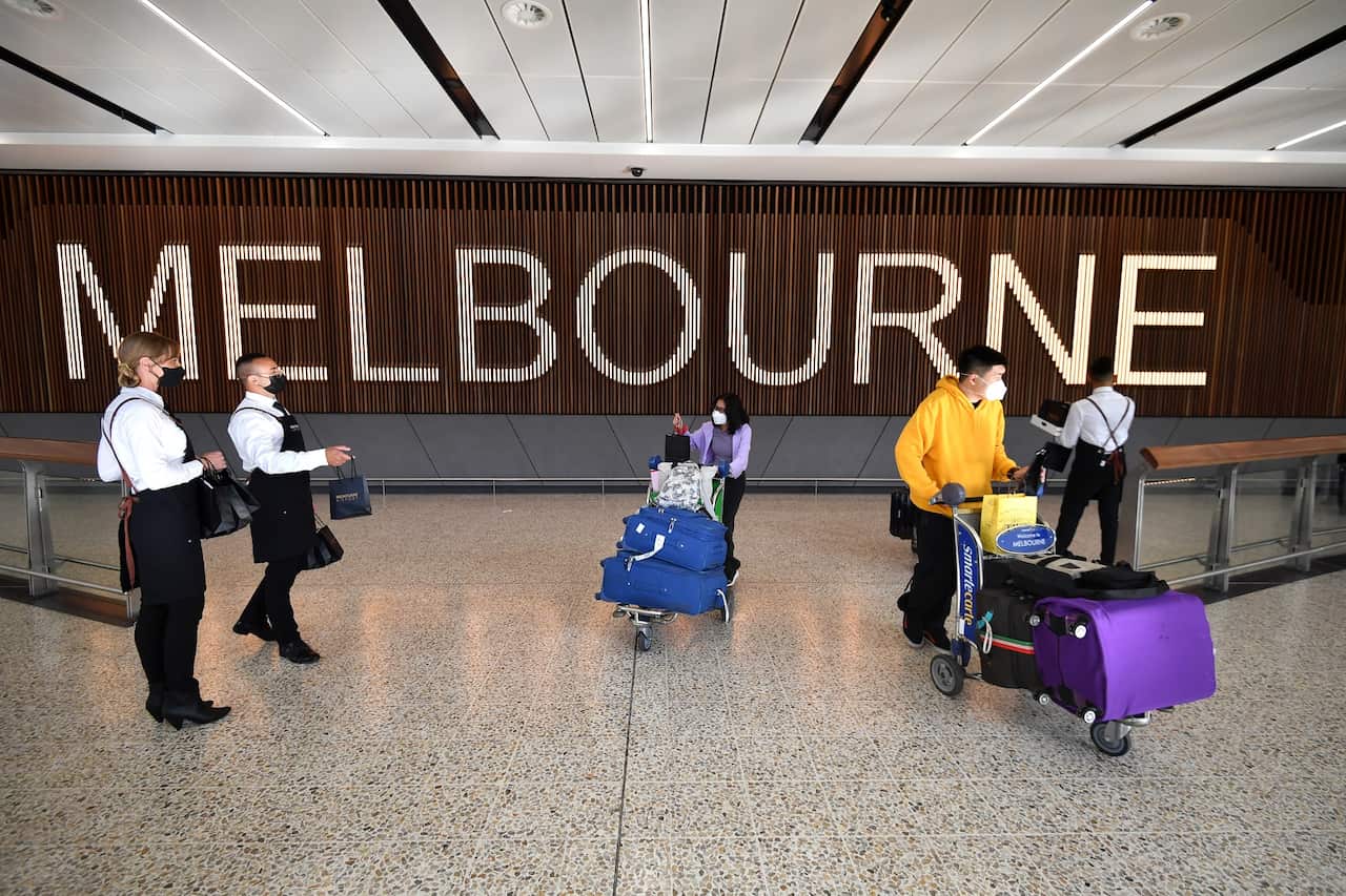 International passengers arrive at Melbourne Airport in Melbourne, Monday, February 21, 2022. Australia’s international borders have reopened without restrictions for fully vaccinated tourists and travellers. (AAP Image/Joel Carrett) NO ARCHIVING