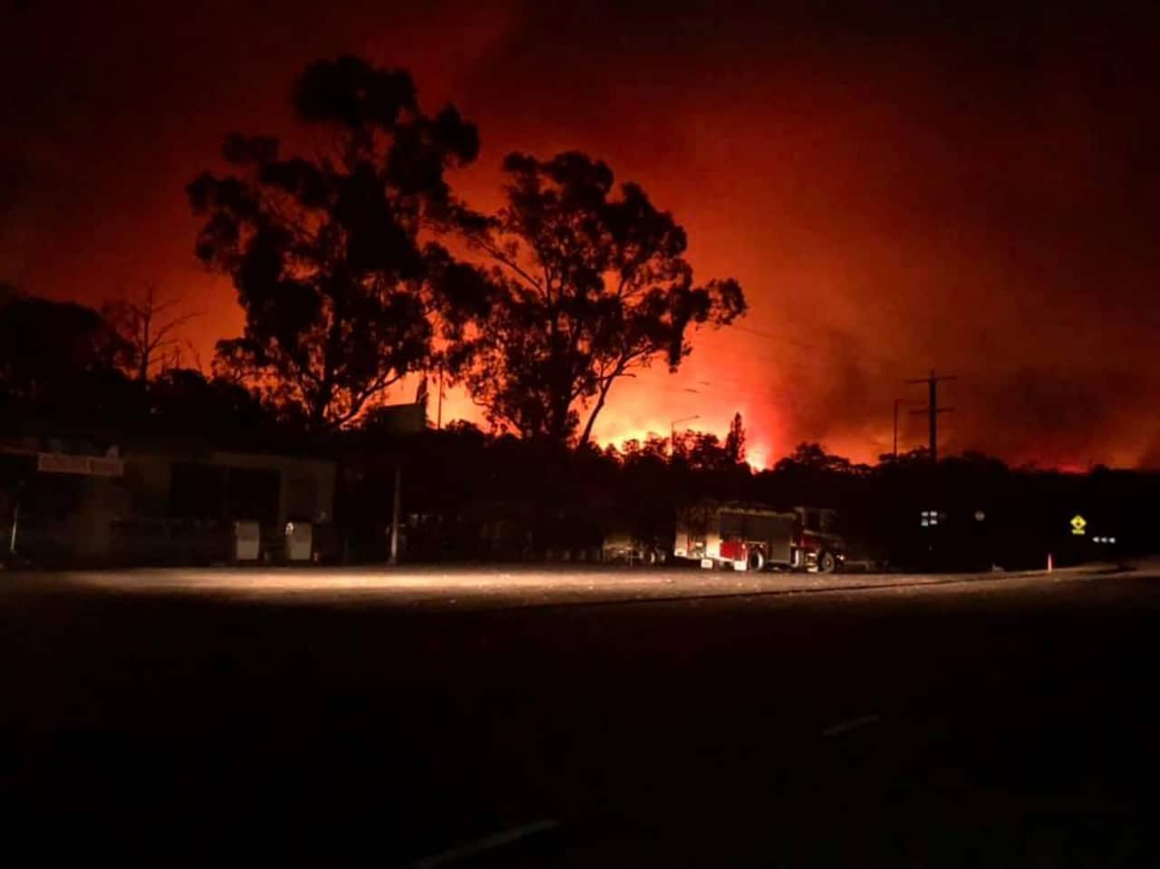 A supplied image obtained Wednesday, January 1, 2020 shows a bushfire near Nowa Nowa general store in Nowa Nowa, East Gippsland, Tuesday, December 31, 2019. (AAP Image/Supplied by Nowa Nowa General Store) NO ARCHIVING, EDITORIAL USE ONLY