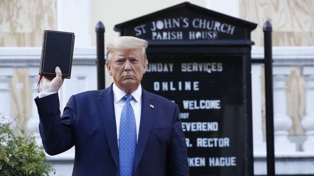 Trump walked through the park to the nearby St John's Church, for an photo opportunity in which he posed with a Bible.