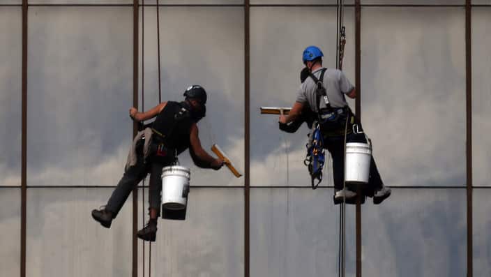 Window cleaners absail down a building to clean the windows of an office block in Perth, Australia.. Picture date: Thursday June 6, 2013. Photo credit should read: David Davies/PA Wire.