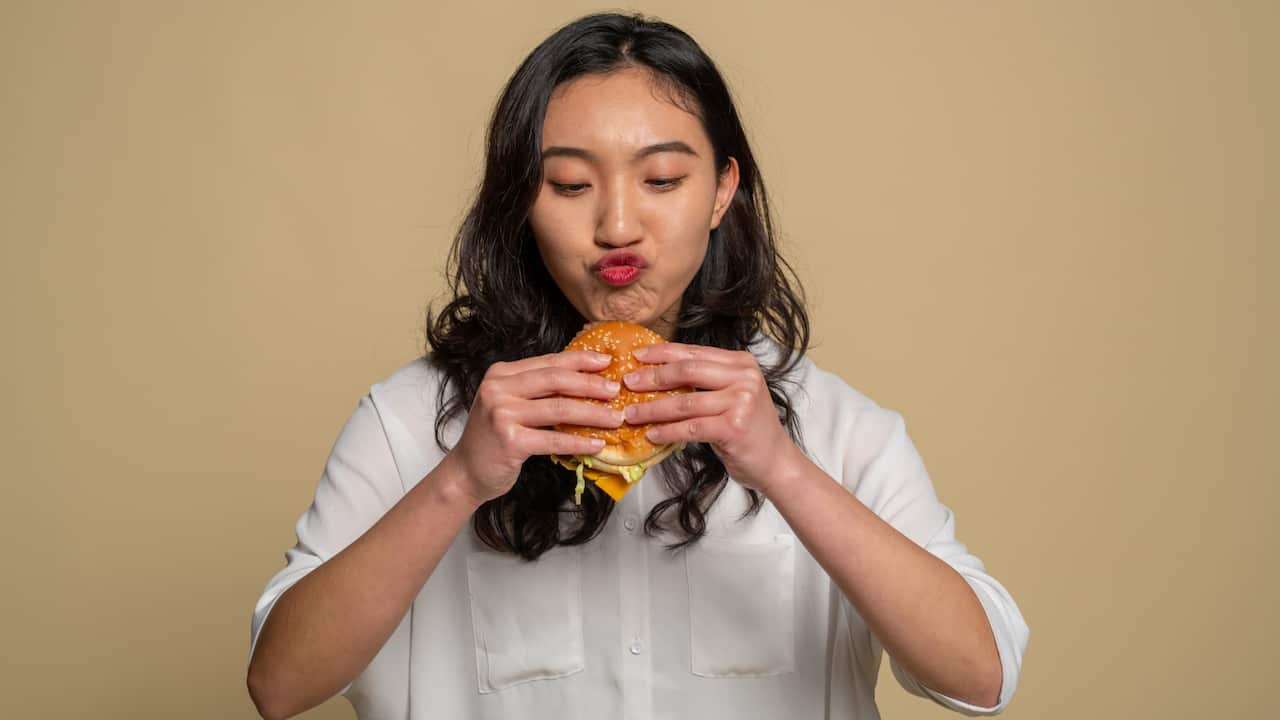 Woman eating a burger