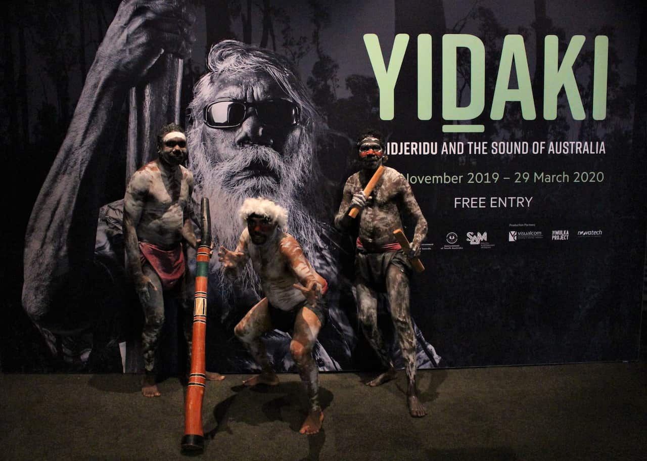 (L-R) yidaki master Larry Gurruwiwi  and members of his family Vernon and Garry Gurruwiwi performing at the launch 
