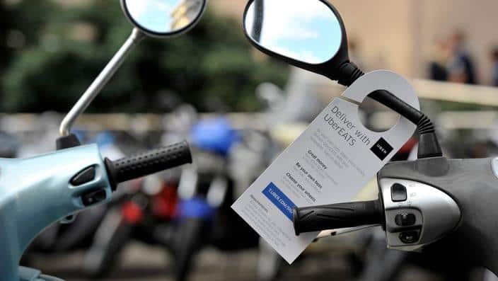 An advertisement seeking drivers for UberEATS on a motorbike in