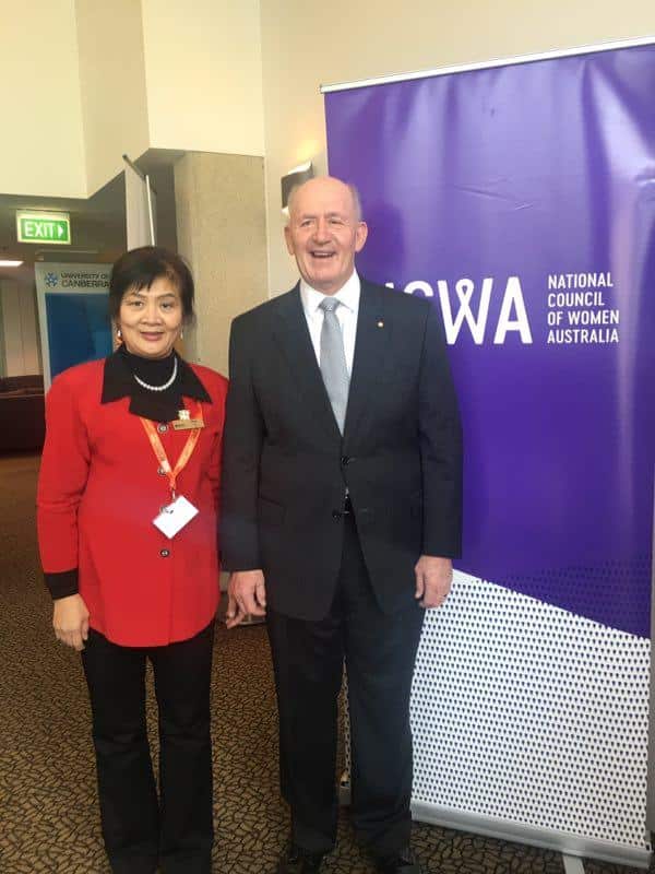 May Hu (left) and Governor-General of Australia Peter Cosgrove (right)