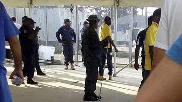 Police entering the immigration camp on Manus Island, Papua New Guinea, Thursday Nov. 23, 2017