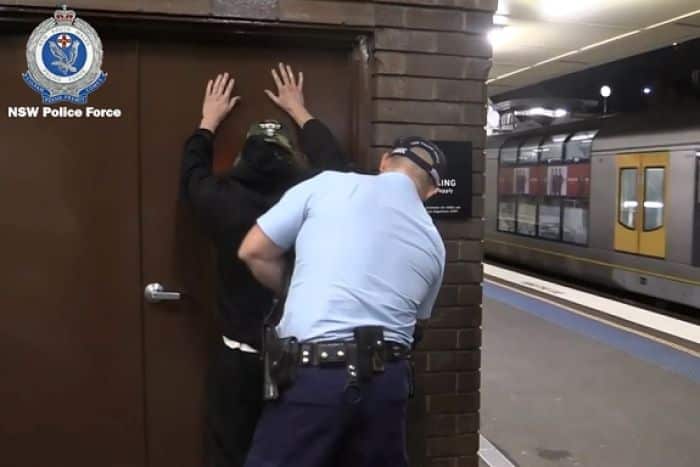 A police officer conducts a search.