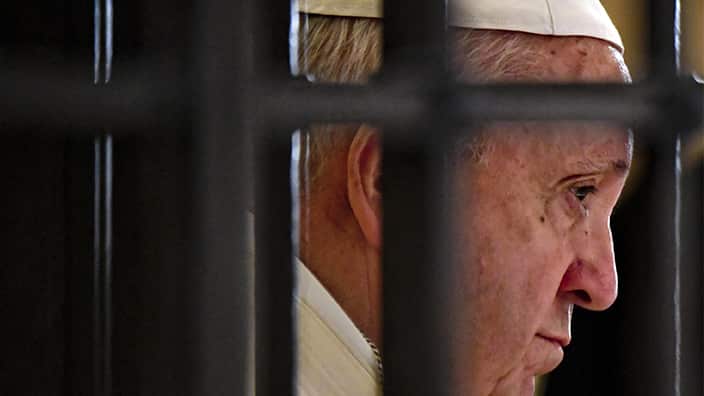 Pope Francis prays in the crypt of the Basilica of Saint Nicholas