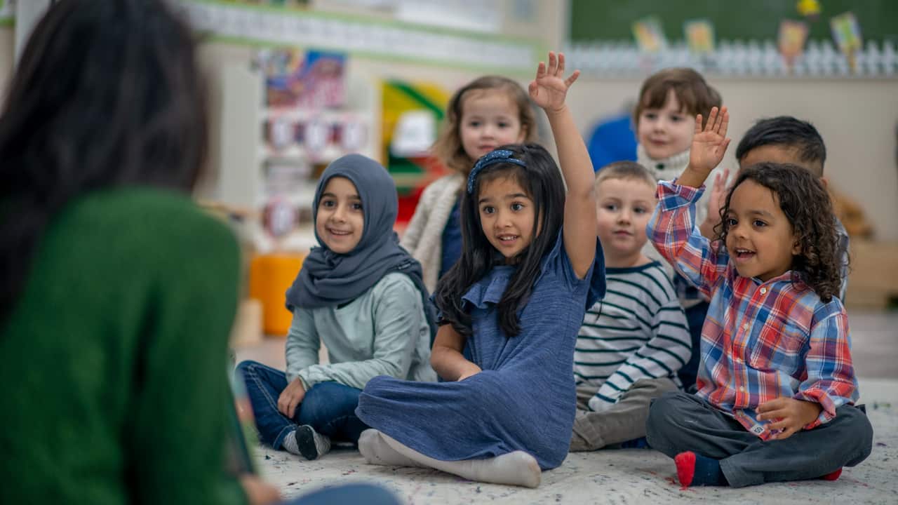 Pre-schoolers learning in their classroom.