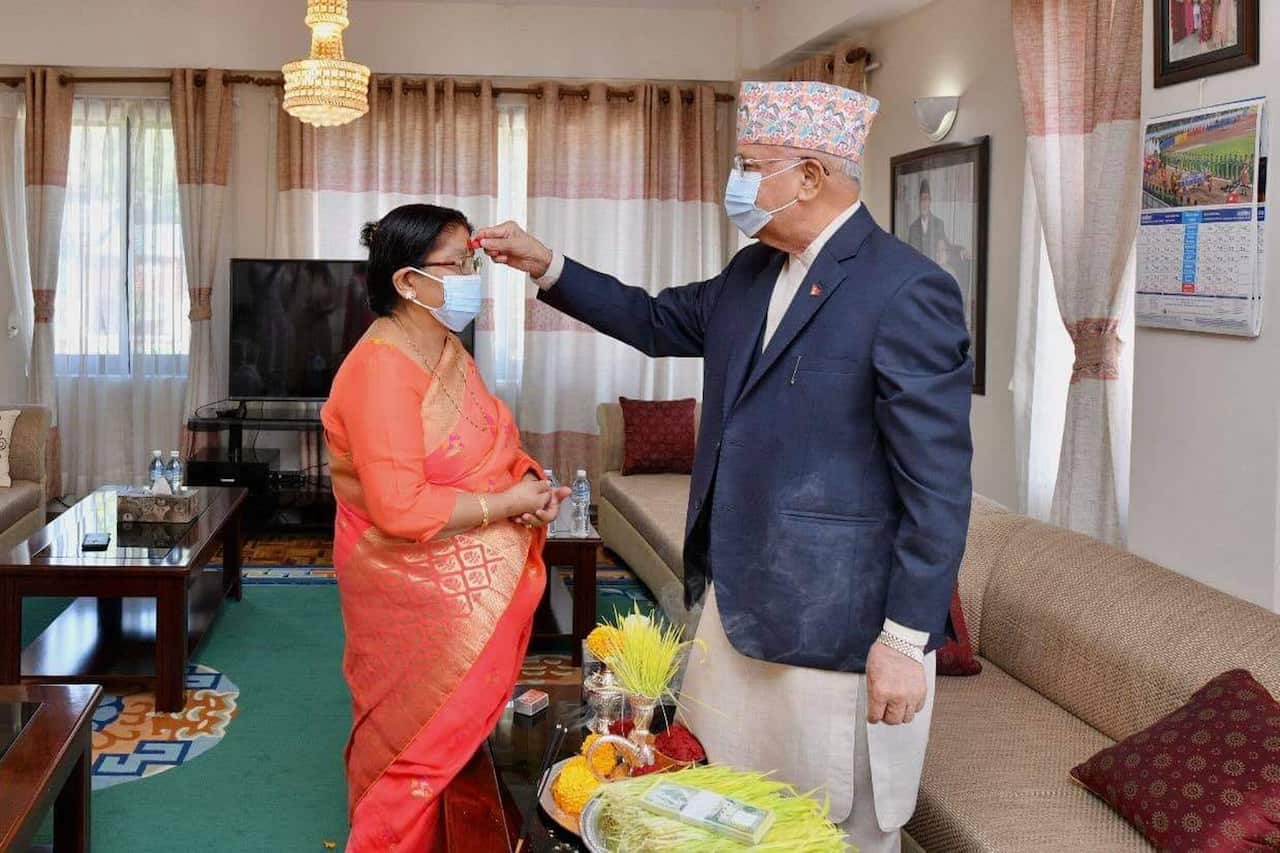 Prime Minister KP Sharma Oli offering tika to his wife Radhika Shakya.
