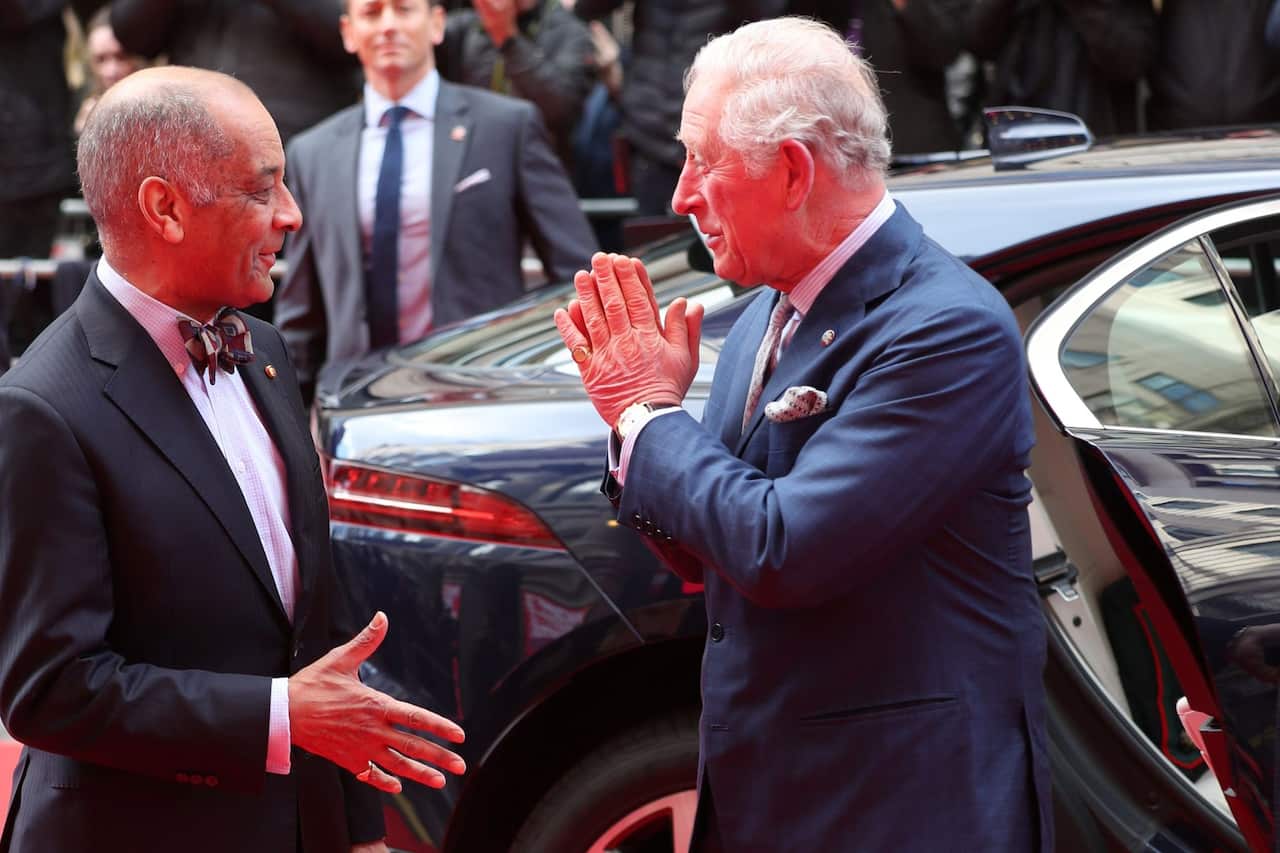 The Prince of Wales greets Sir Kenneth Olisa, The Lord-Lieutenant of Greater London (left) with a Namaste gesture at the annual Prince's Trust Awards 2020.