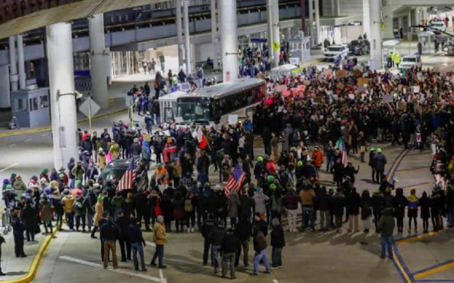Above: Protesters against Trump's Muslim ban at O'Hare airport in Chicago.