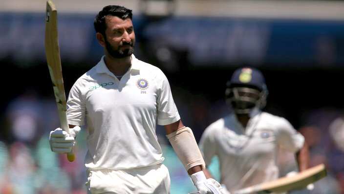 India's Cheteshwar Pujara waves his bat as walks off after he was caught out for 193 runs against Australia on day 2 during their cricket test match in Sydney, Friday, Jan. 4, 2019. (AP Photo/Rick Rycroft)