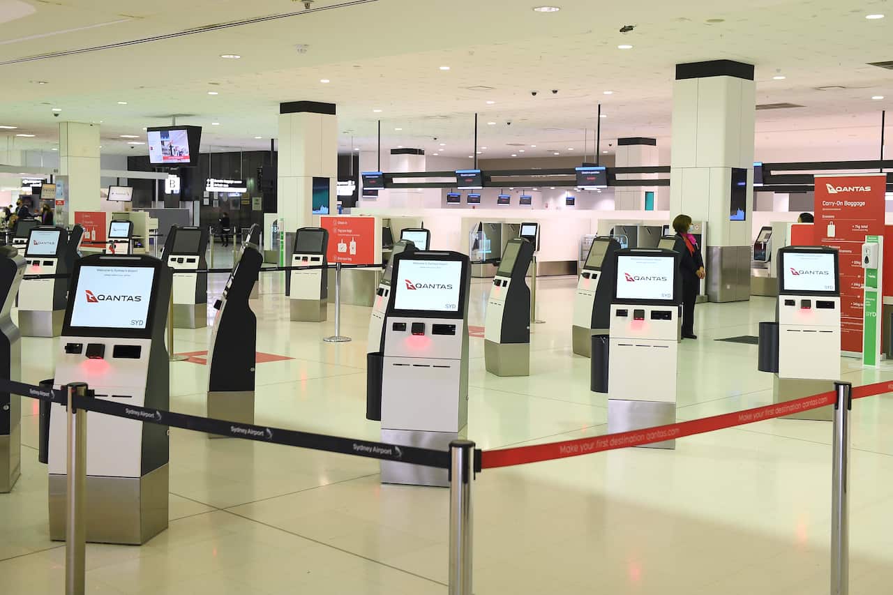 The Qantas check in counter is seen at Sydney International Airport