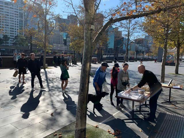 Queue outside the Rockpool Bar & Grill in Melbourne, where the meals are distributed every day from 12 to 4pm. 