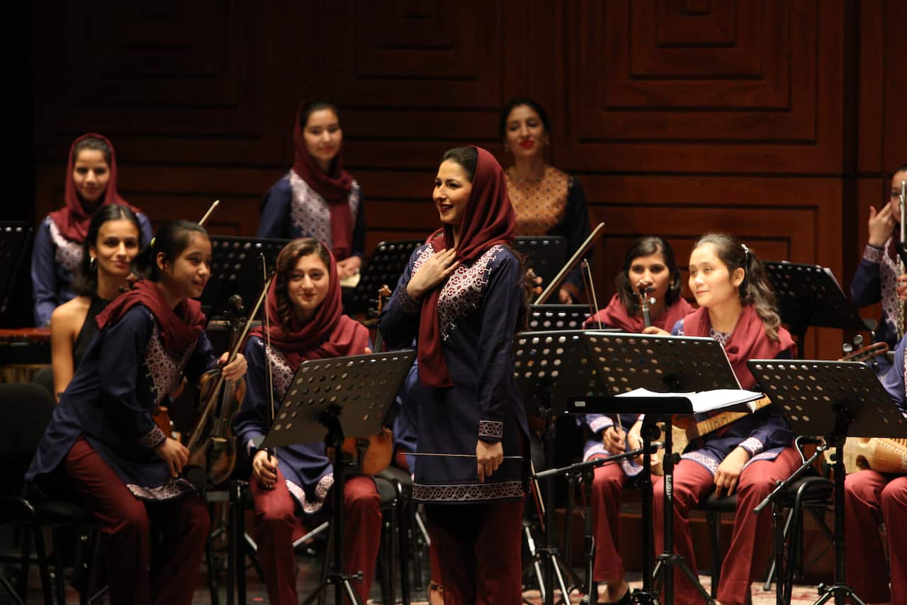 Afghanistan’s first female conductor Negin Khpalwak (standing in the middle).