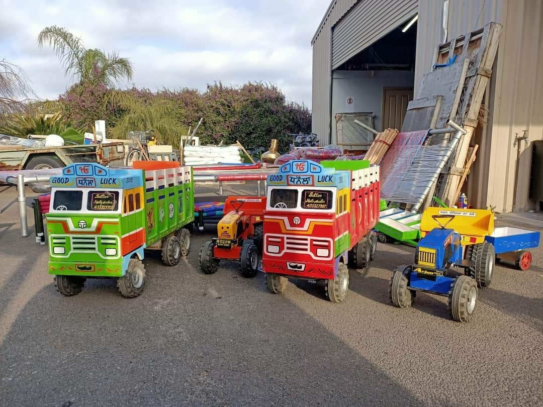 Truck and tractor toys made-up of wood and plastic.