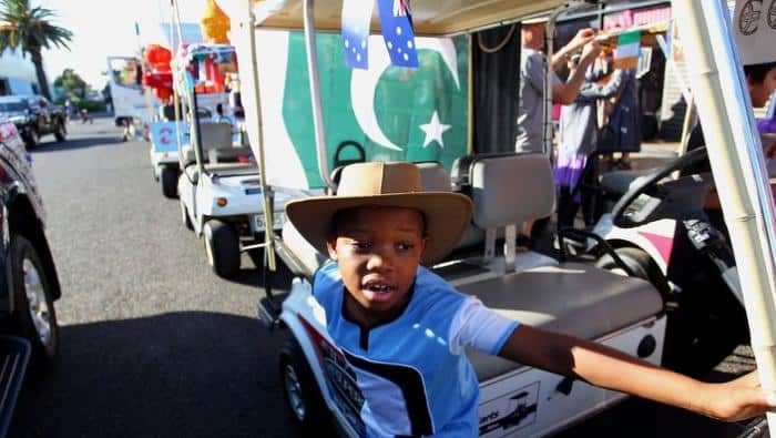 Rathamile Radebe helps prepare floats on Peel Street during the Tamworth Country Music Festival Cavalcade on January 28, 2017