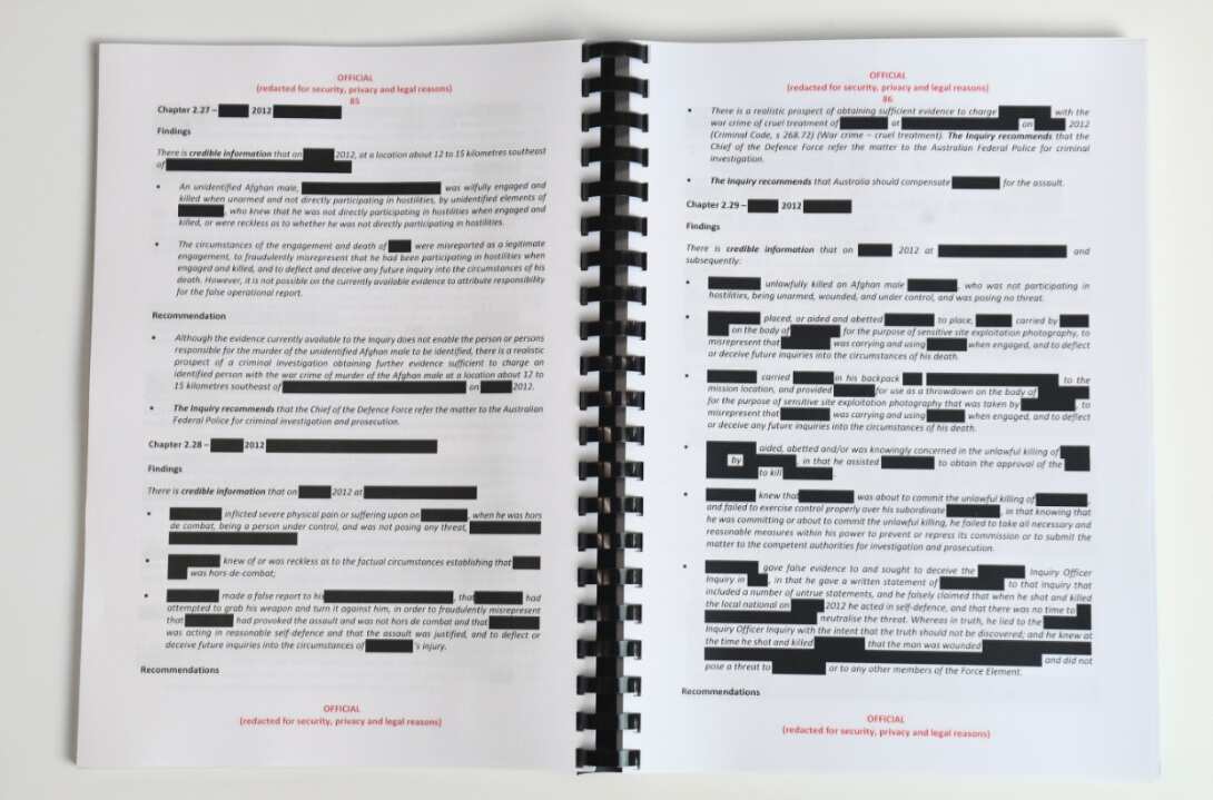 Redacted parts are seen of the report by the Inspector-General of the Australian Defence Force Afghanistan Inquiry in Canberra.