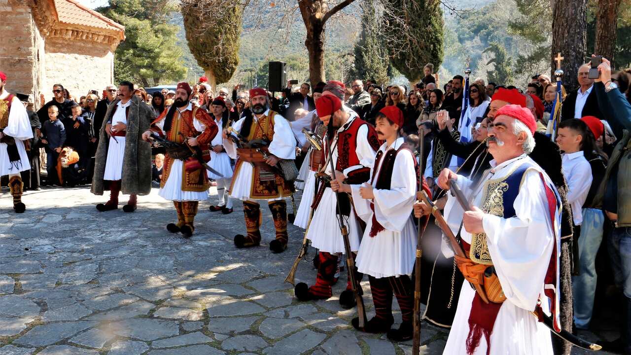 Men in traditional Greek fighters costumes