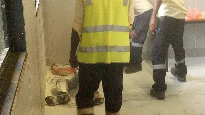 A Somali refugee is tended to by authorities