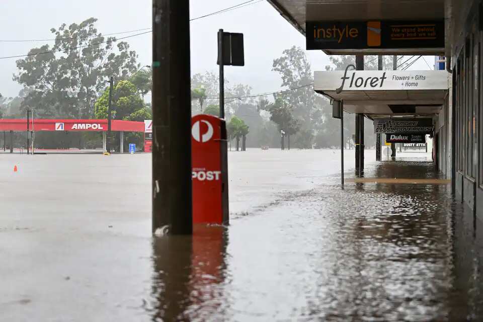 Shops are inundated by floodwater in the central business district in Lismore.