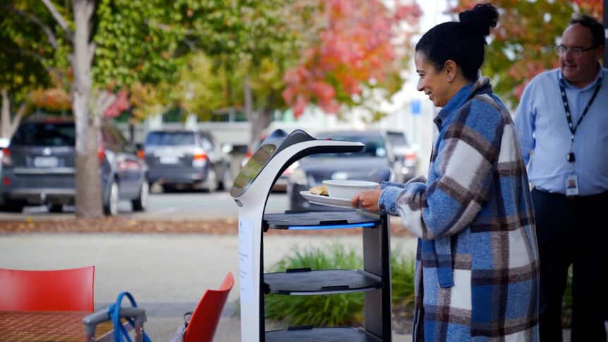 Canberra cafe owner hires robot to deliver food and drinks to tables