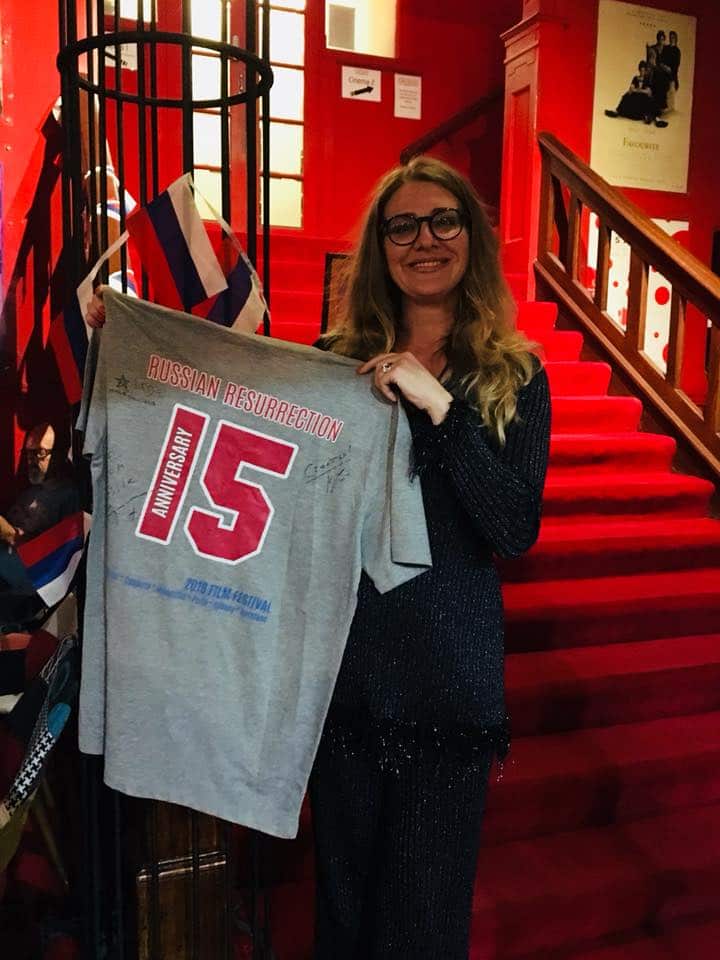 The winner of a movie Quiz at opening of anniversary Russian Resurrection Film Festival in Perth holds a t-shirt with Konstantin Khabensky and Danila Kozlowski's autographs.