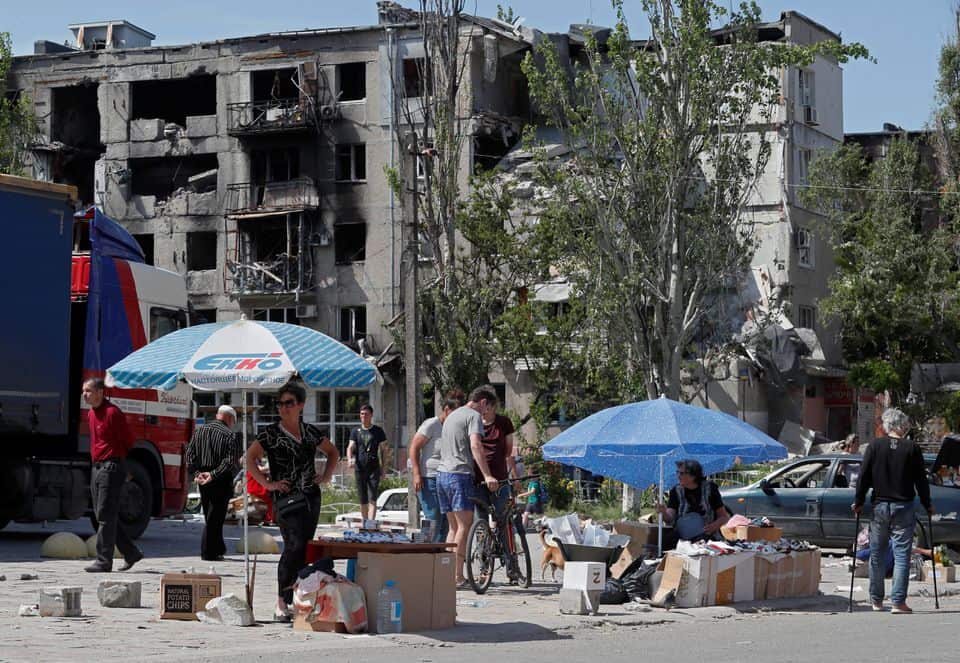 Street vendors sell goods during Ukraine-Russia conflict in the southern port city of Mariupol, Ukraine May 30, 2022.