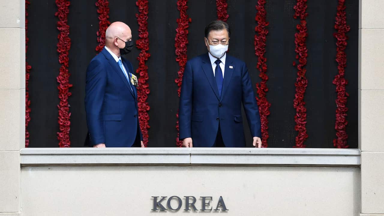 South Korean President Moon Jae-in (R) and Assistant Director of the Australian War Memorial Brian Dawson (L) view the Roll of Honour.