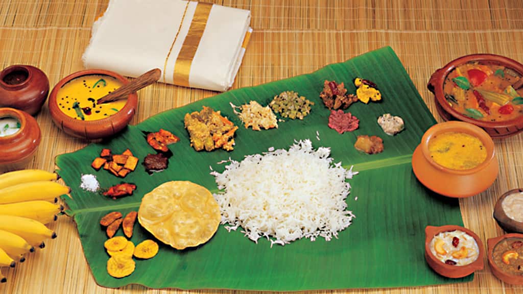 Famous- Onam Sadhya served traditionally on a banana leaf
