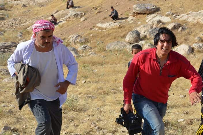 Salim Hussein left, during filming 