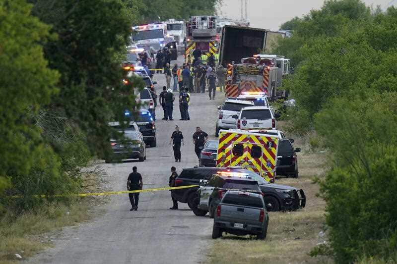 Police and paramedics descend on the scene of a tractor-trailer in San Antonio, Texas, where 53 illegal migrants from Central and South America died.