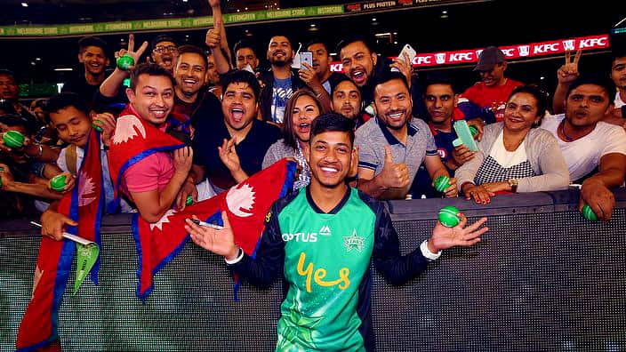 Sandeep Lamichhane with Nepali cricket fans at the Melbourne Cricket Ground